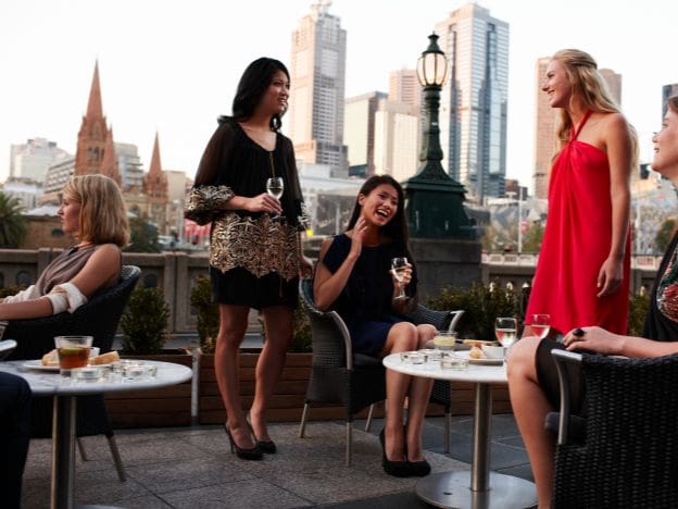 Drinks at Melbourne rooftop bar credit Tourism Australia